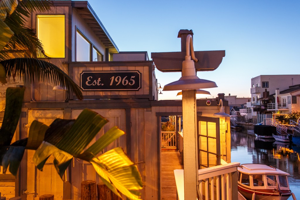 outside view of restaurant with deck signs on waterfront